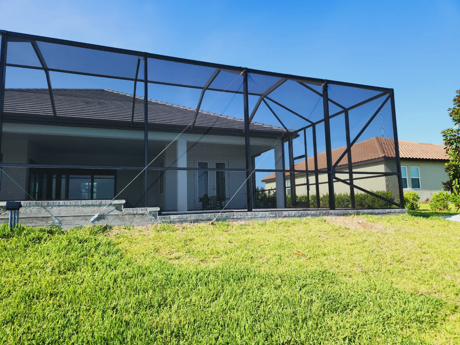 Custom aluminum pool screen enclosure built by All Aluminum & Screening in Brevard County, FL